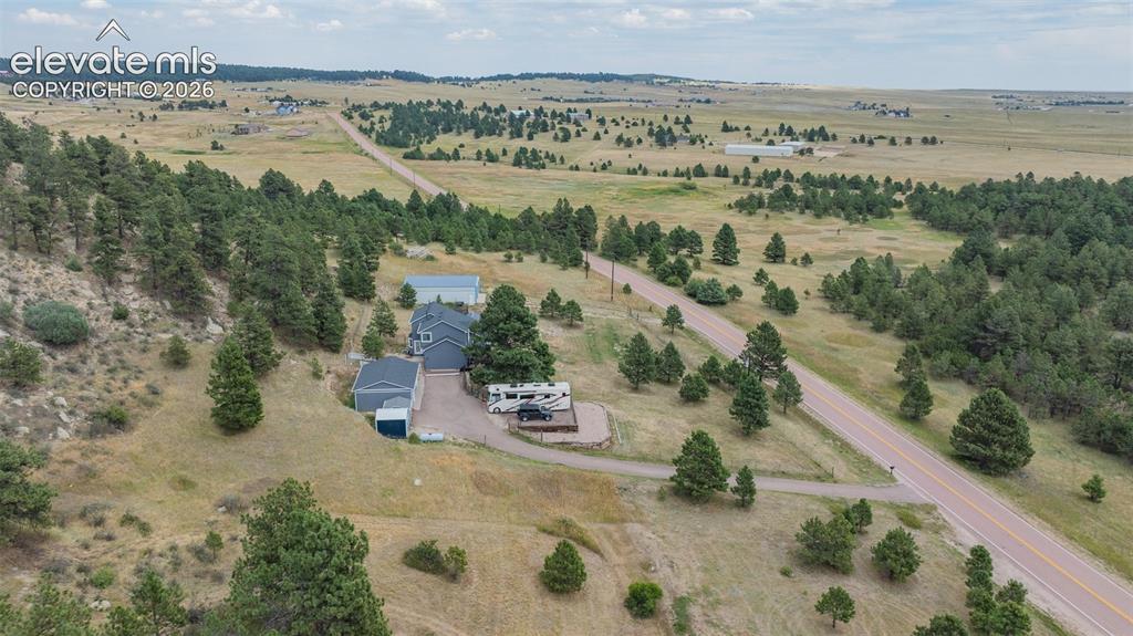 17370 Sweet Road Peyton, CO 80831 - Photo 7 of 38 Aerial view of property's location and scenic landscape, a rural paradise.