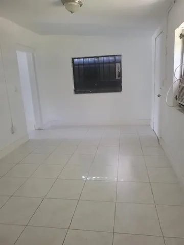 a kitchen with a stove sink and refrigerator