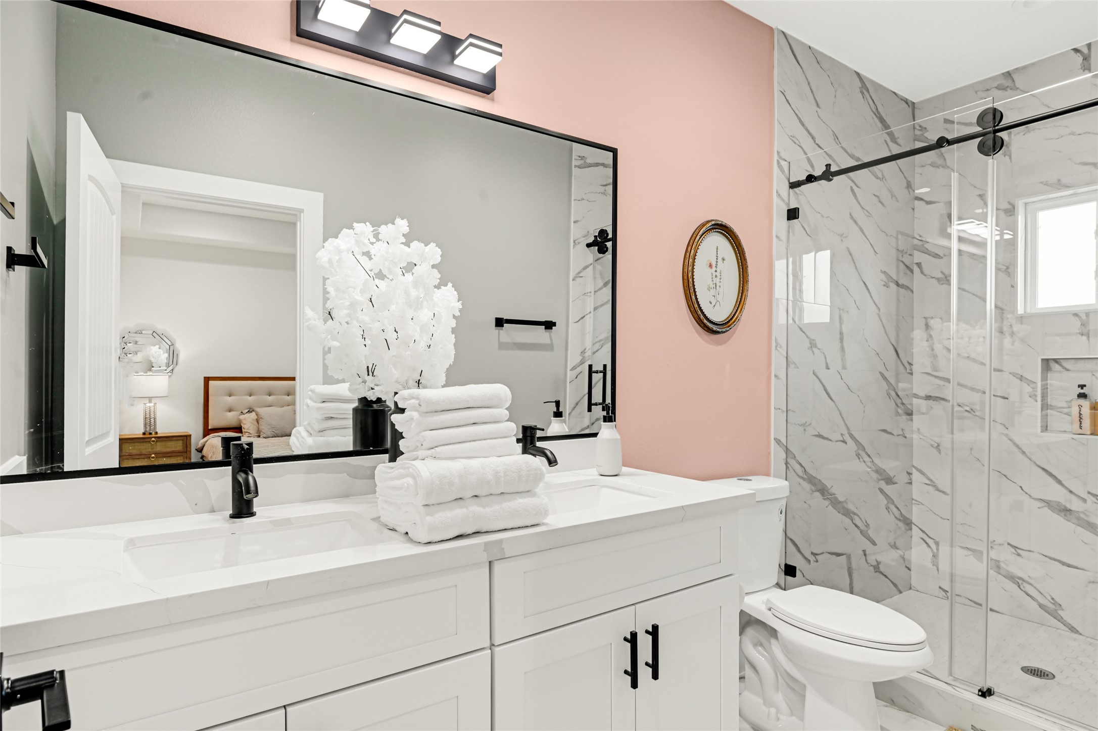 3834 Mt Pleasant Street Houston, TX 77021 - Photo 23 of 33 a bathroom with a sink a toilet and a mirror