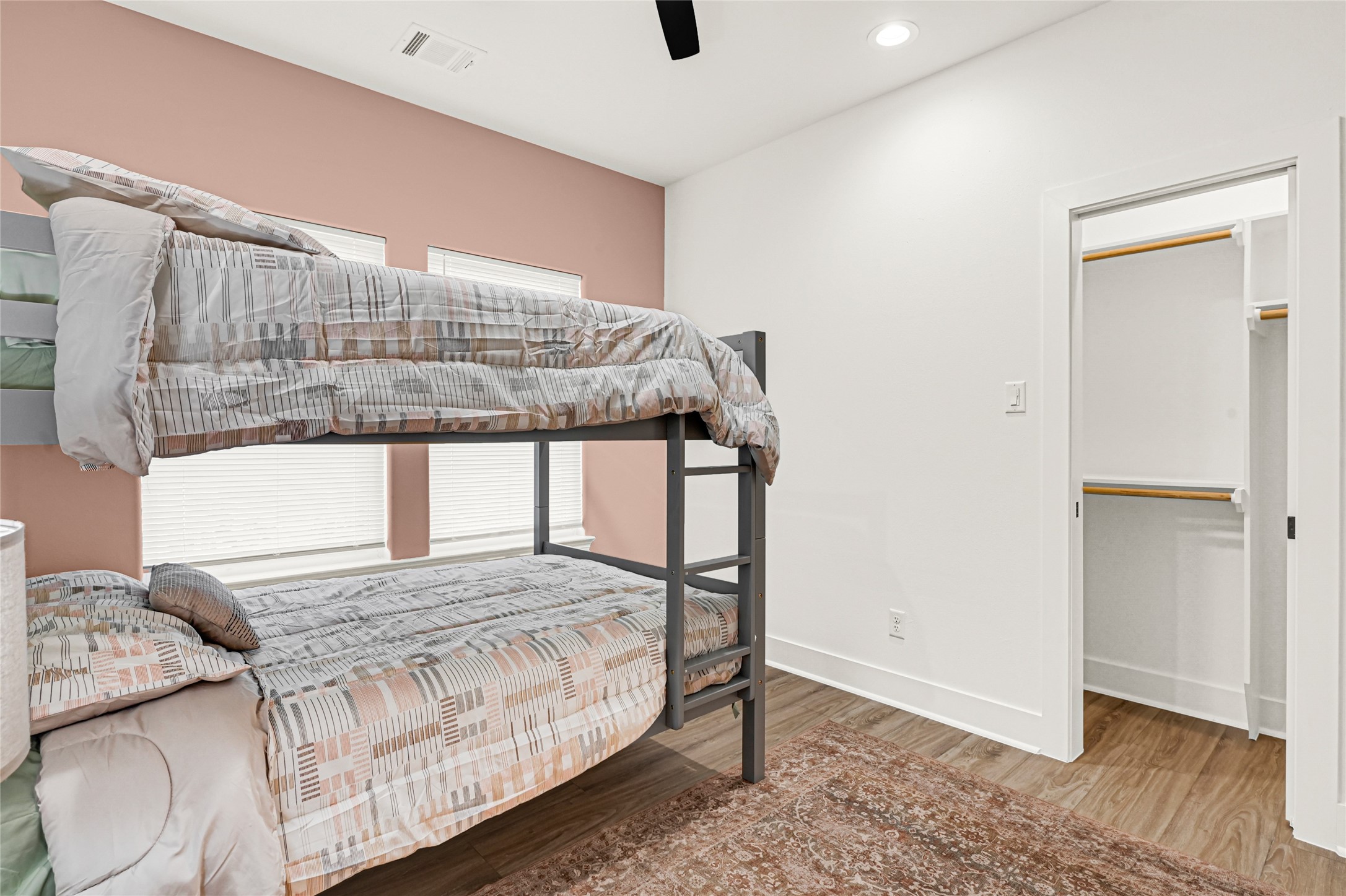 3834 Mt Pleasant Street Houston, TX 77021 - Photo 26 of 33 a bedroom with a bed a window and wooden floor