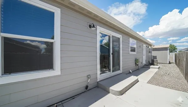 a view of backyard with large windows