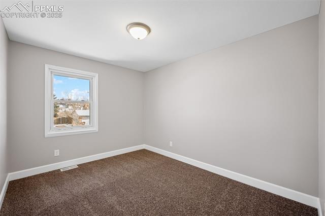 6319 Chippewa Road Colorado Springs, CO 80915 - Photo 28 of 36 Empty room with carpet flooring