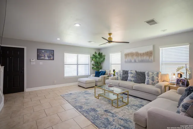 a living room with furniture and window