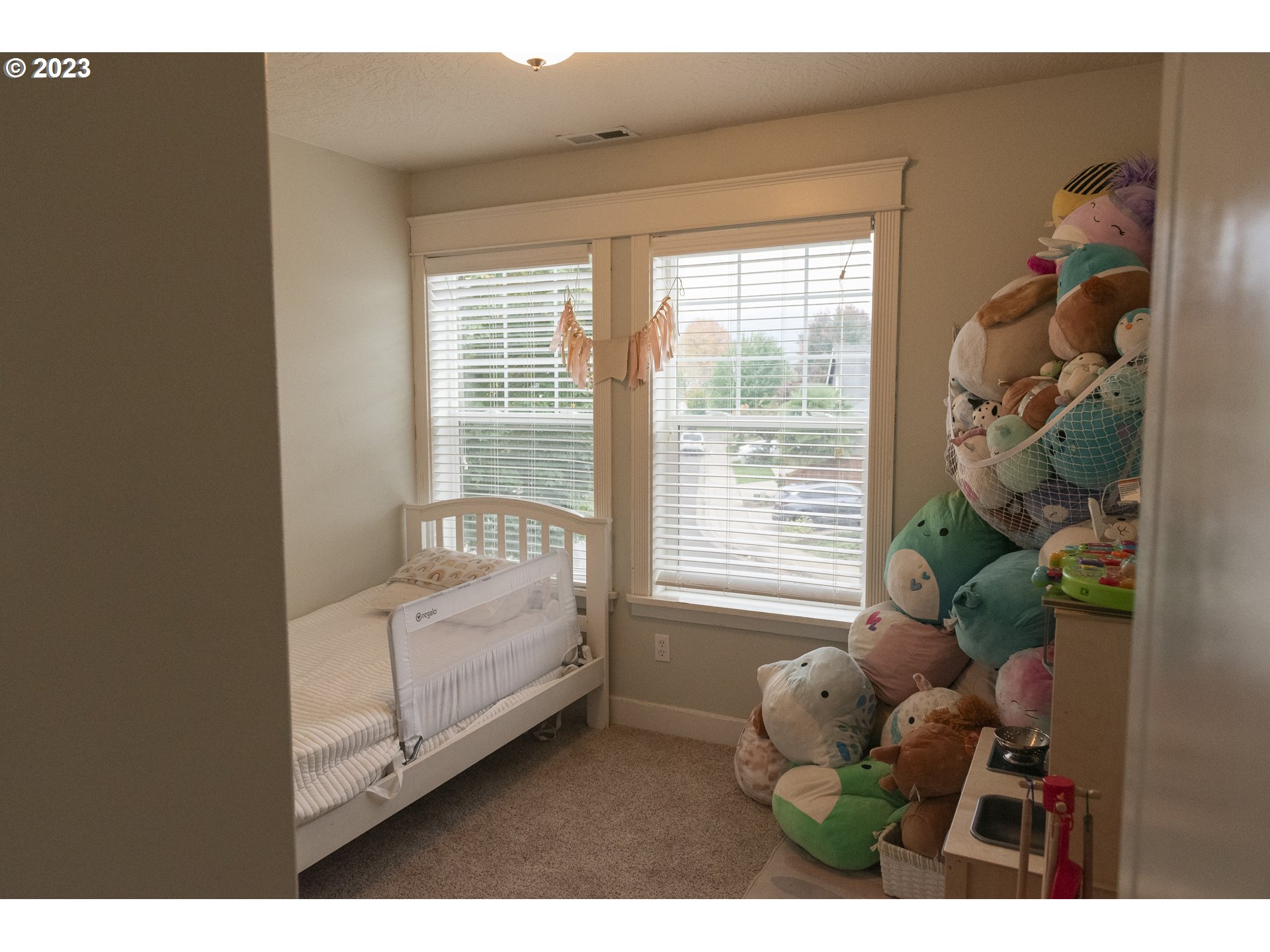 6790 Jacob Lane Springfield, OR 97478 - Photo 18 of 30 a bedroom with furniture and a large window