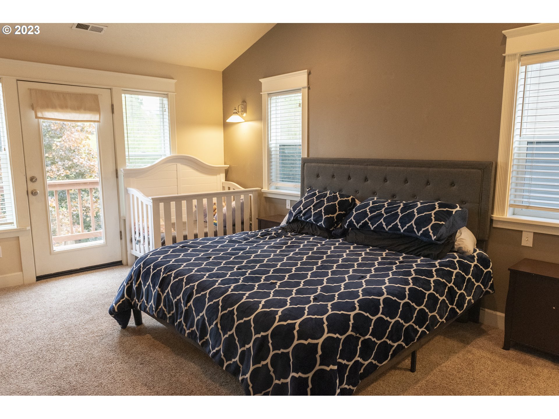 6790 Jacob Lane Springfield, OR 97478 - Photo 20 of 30 a bedroom with a large bed and a window