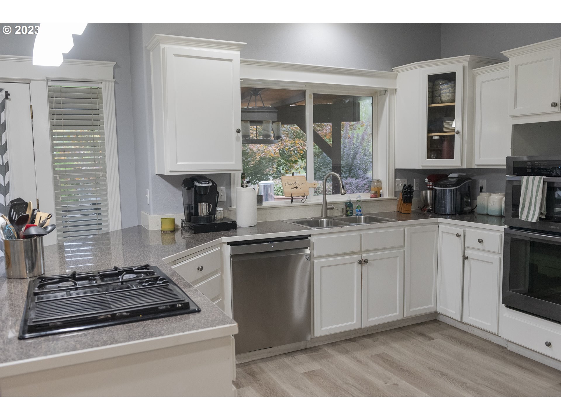 6790 Jacob Lane Springfield, OR 97478 - Photo 5 of 30 a kitchen with stainless steel appliances granite countertop a sink stove and cabinets