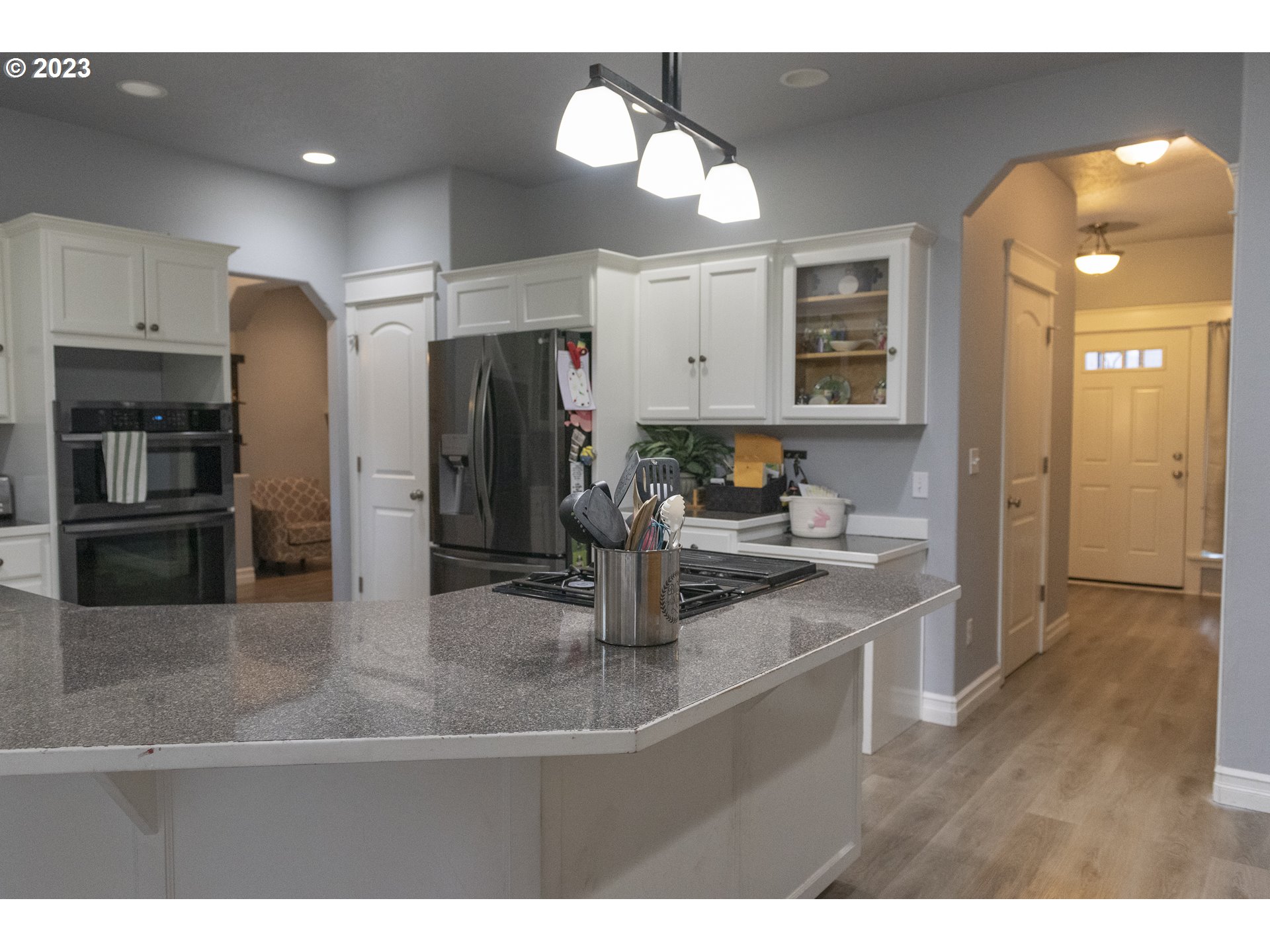 6790 Jacob Lane Springfield, OR 97478 - Photo 6 of 30 a kitchen with stainless steel appliances granite countertop a sink and refrigerator
