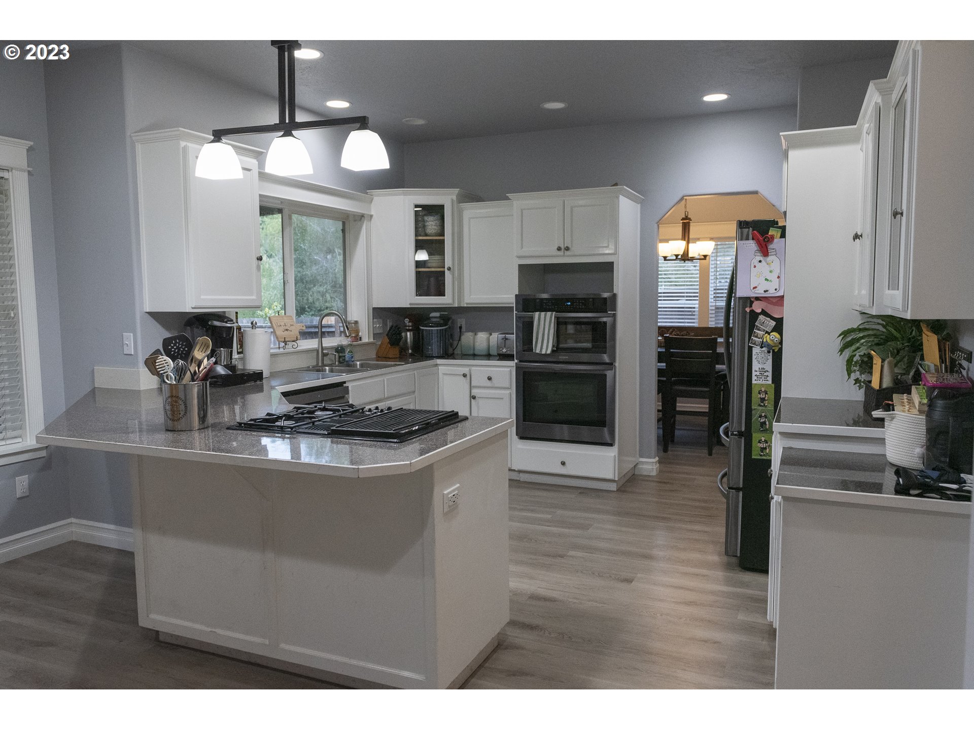 6790 Jacob Lane Springfield, OR 97478 - Photo 7 of 30 a kitchen with stainless steel appliances granite countertop a sink a stove and refrigerator