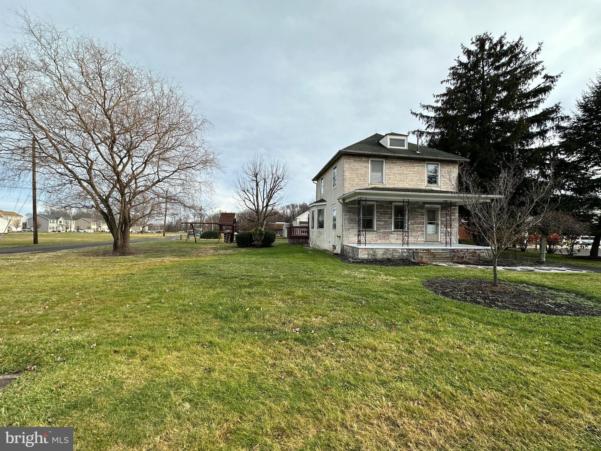 4007 Hulmeville Road Bensalem, PA 19020 - Photo 16 of 16 a view of a house with a big yard