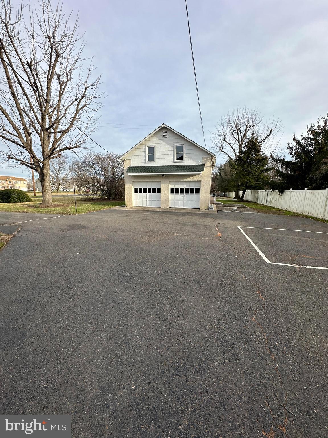4007 Hulmeville Road Bensalem, PA 19020 - Photo 3 of 16 a view of a house with a yard and garage