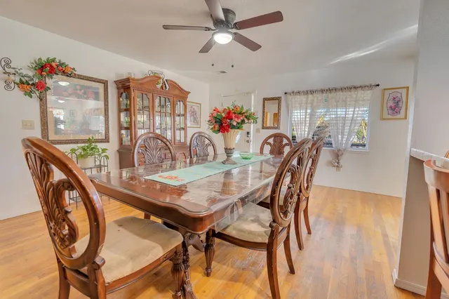 a dining room with furniture and window
