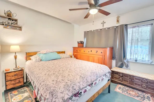 a bedroom with a bed and a dresser