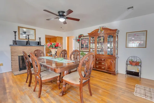 a dining room with furniture and window