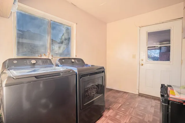 a utility room with dryer and washer