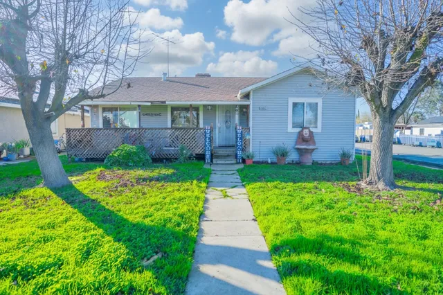 a front view of a house with garden