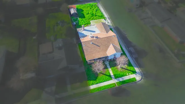 a couple of cars parked in front of a building
