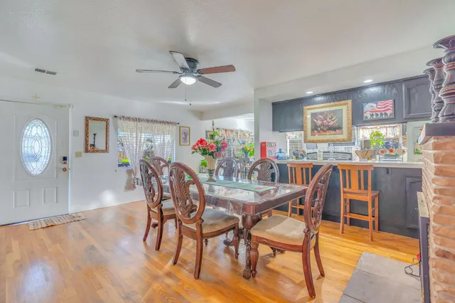 a dining room with furniture and window