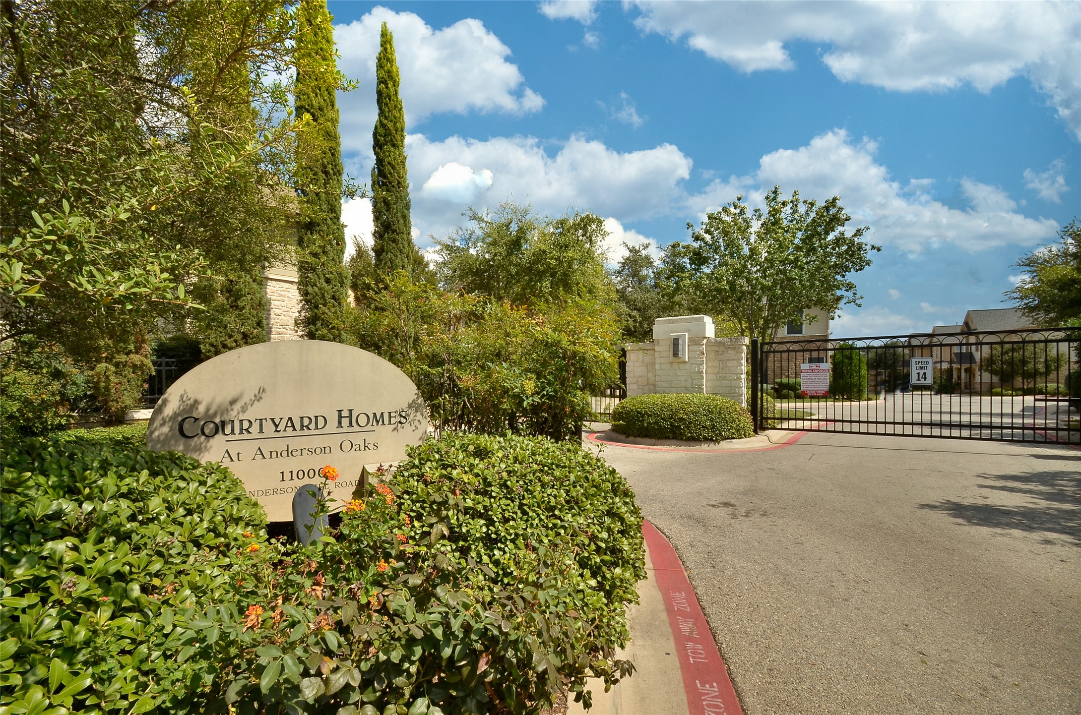 11000 Anderson Mill Road, Unit 45 Austin, TX 78750 - Photo 25 of 32 a front view of a house with a garden