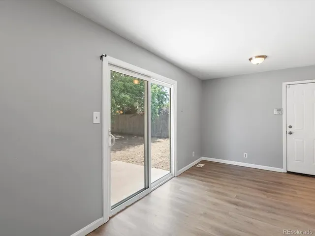 a view of a hallway with washer and dryer