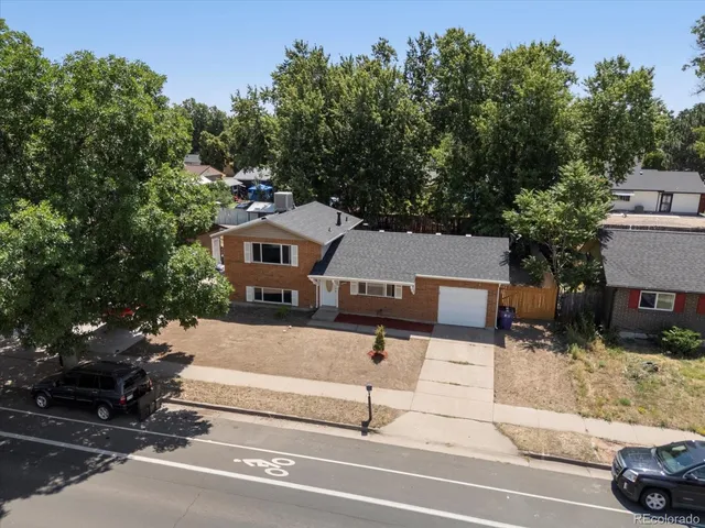a view of a city street and trees
