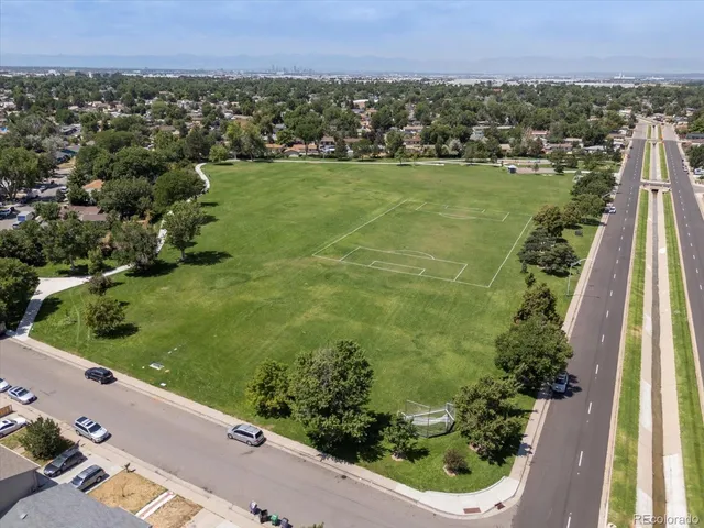 an aerial view of residential houses with outdoor space