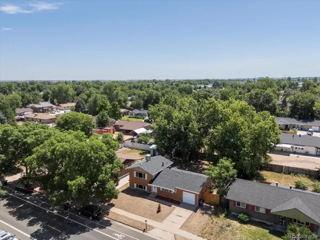 an aerial view of a house with lots of trees