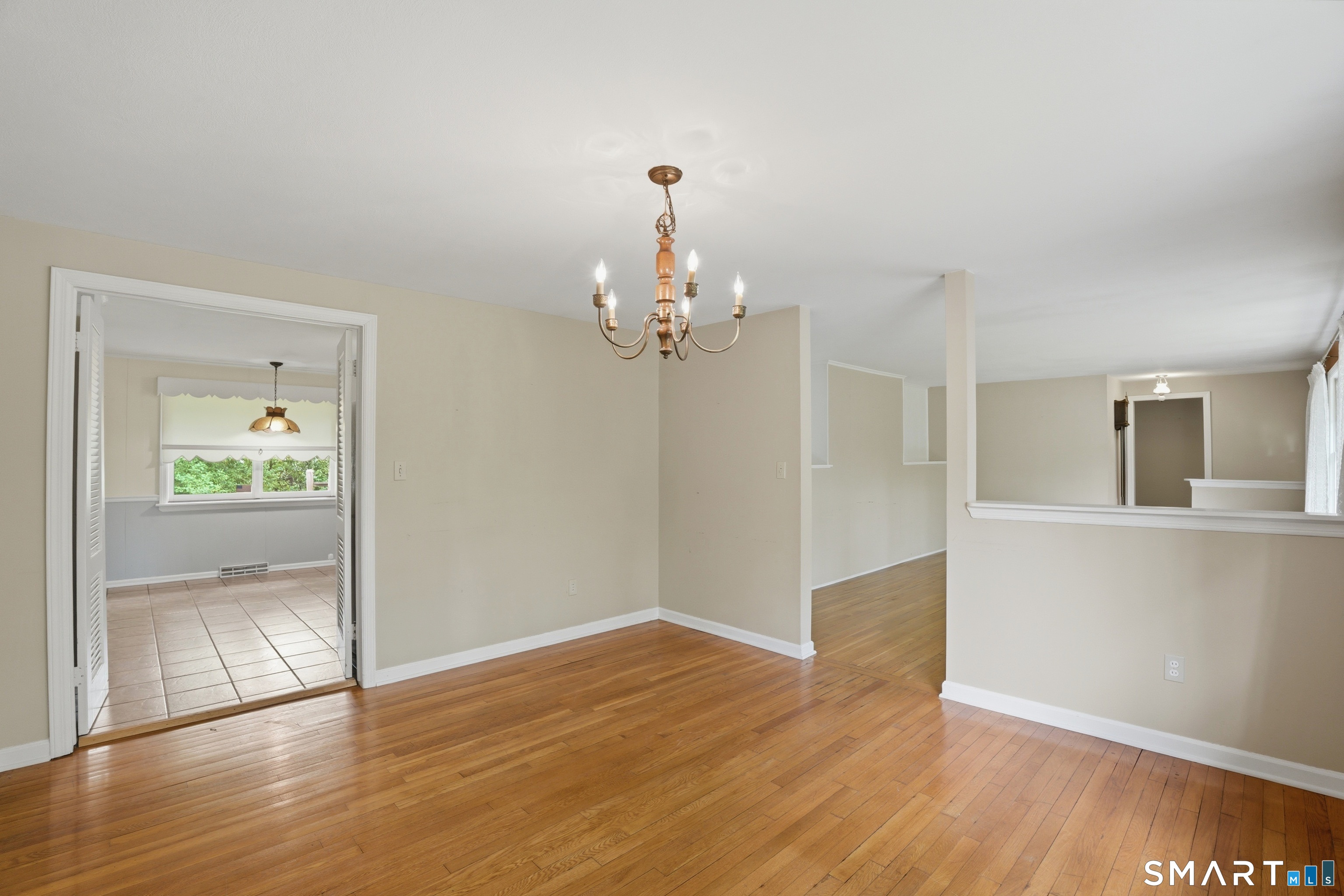 731 Still Hill Road Hamden, CT 06518 - Photo 9 of 40 a view of a chandelier in big room and wooden floor