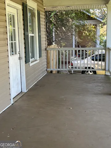a view of a building with a floor to ceiling window and an outdoor view