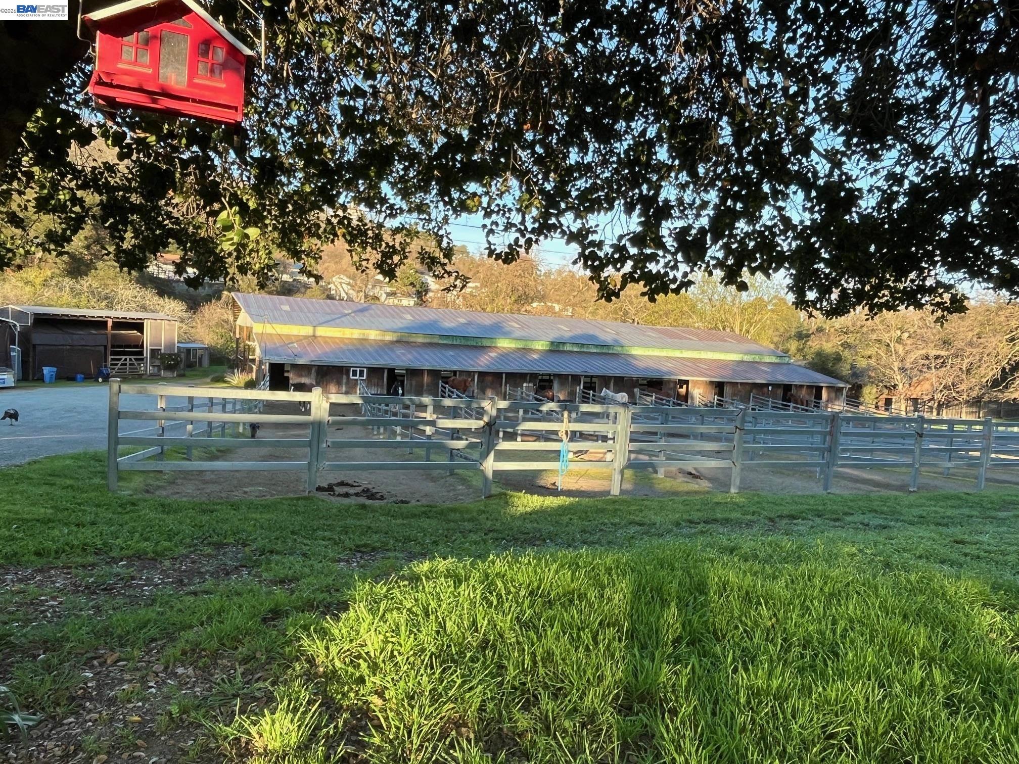 401 Pine Creek Road Walnut Creek, CA 94598 - Photo 7 of 11 a backyard of a house with lots of green space and fountain
