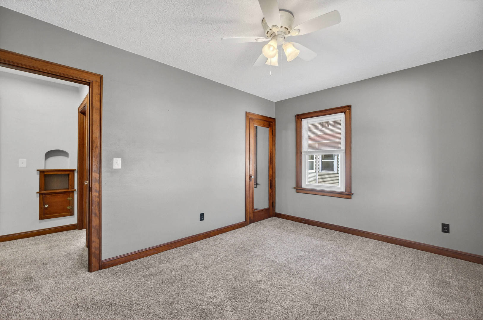 317 West Le Claire Road Eldridge, IA 52748 - Photo 16 of 43 an empty room with windows and fan
