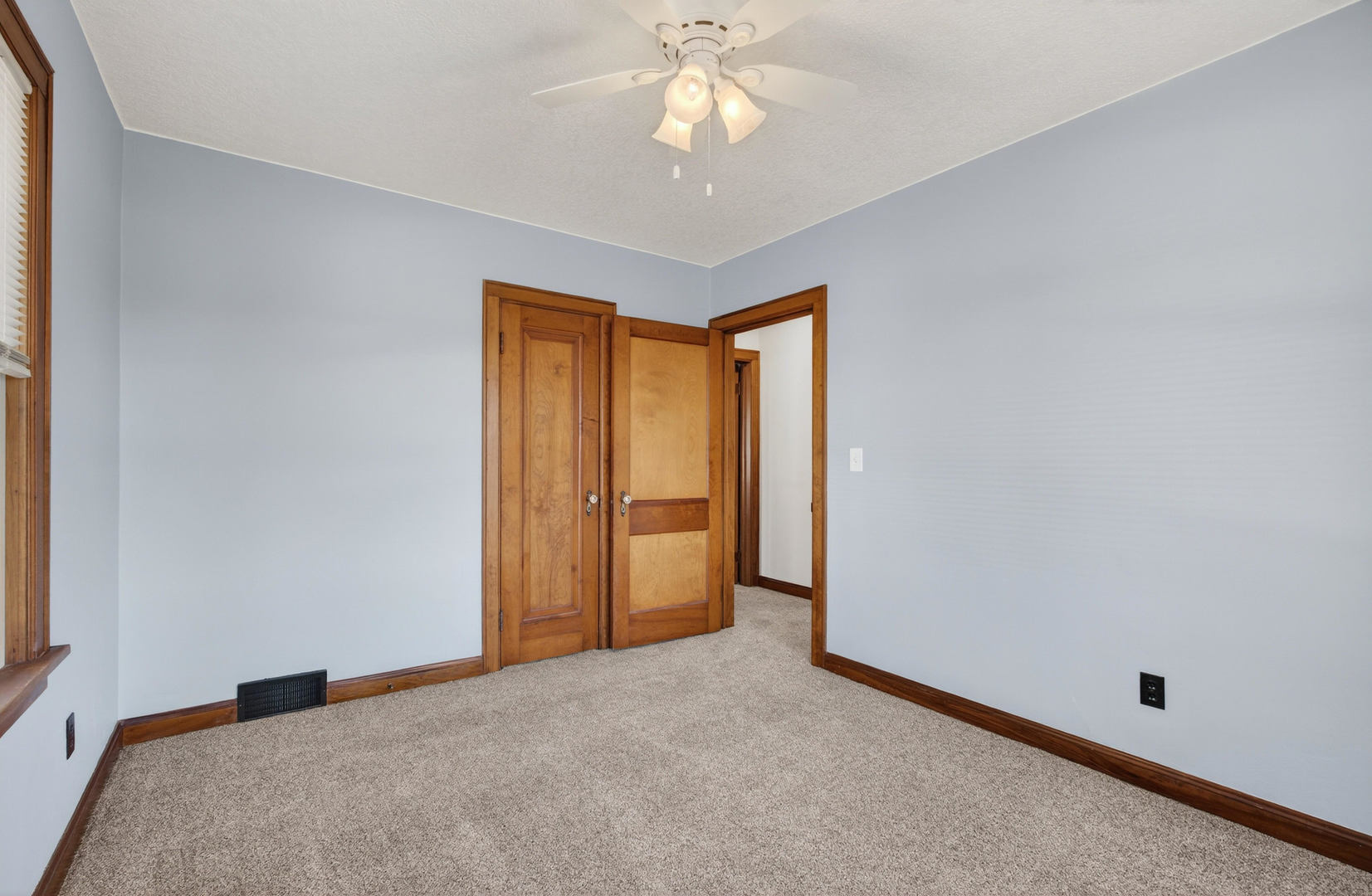 317 West Le Claire Road Eldridge, IA 52748 - Photo 18 of 43 a view of an empty room with a window