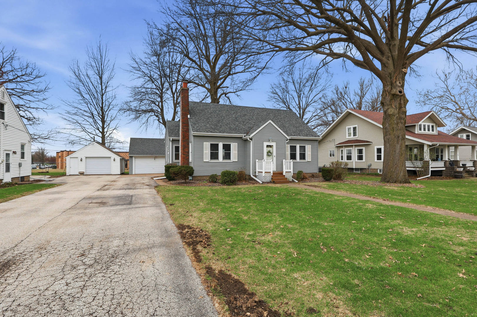 317 West Le Claire Road Eldridge, IA 52748 - Photo 2 of 43 a view of house with yard and green space