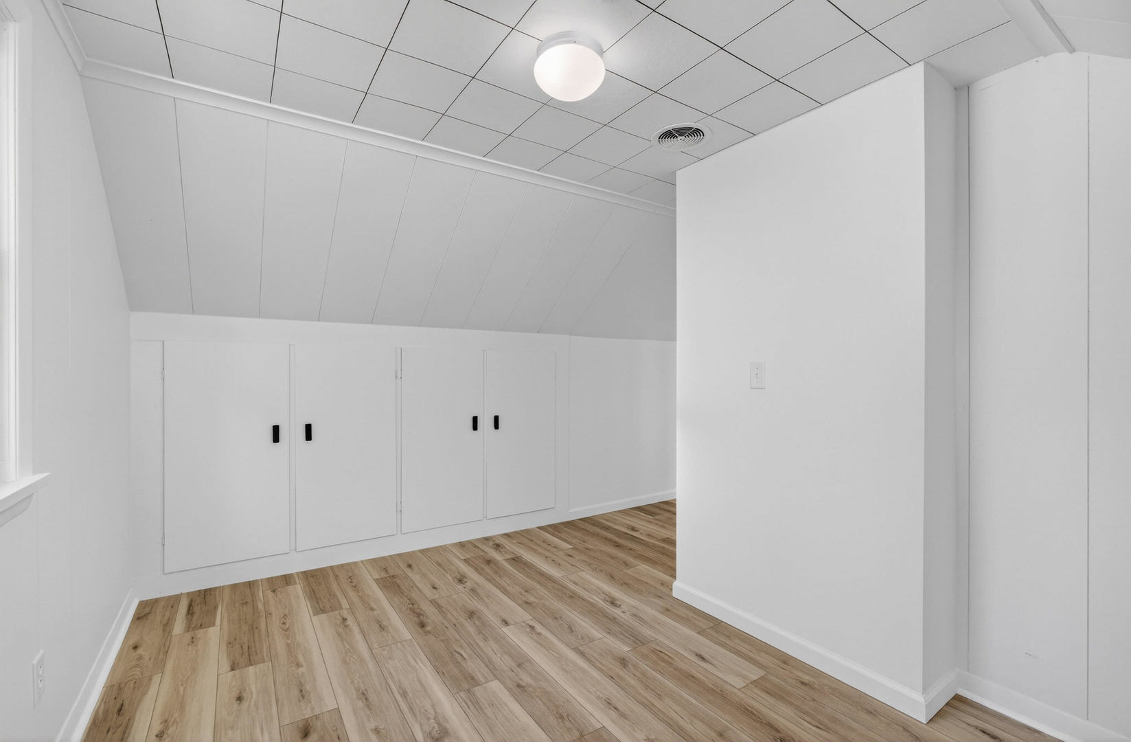 317 West Le Claire Road Eldridge, IA 52748 - Photo 26 of 43 a view of an empty room with wooden floor