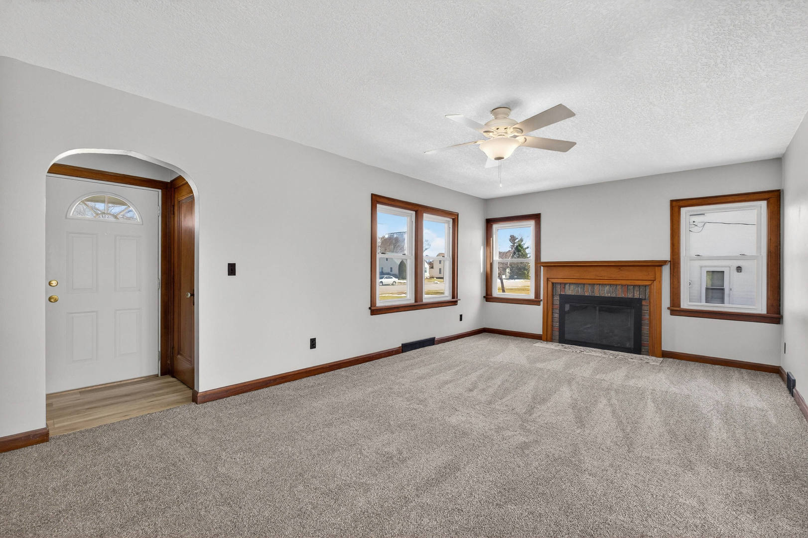 317 West Le Claire Road Eldridge, IA 52748 - Photo 3 of 43 a view of an empty room with window and fireplace
