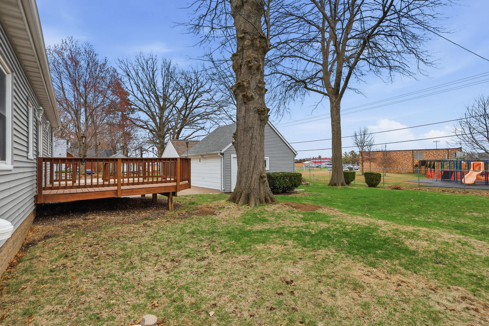 317 West Le Claire Road Eldridge, IA 52748 - Photo 37 of 43 a view of a house with backyard and a tree