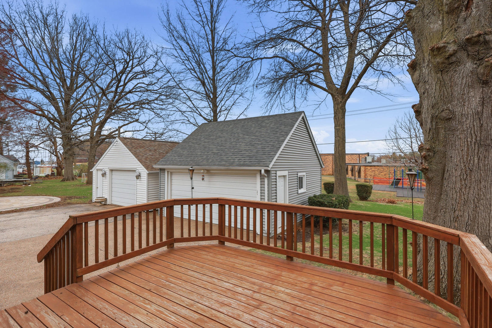 317 West Le Claire Road Eldridge, IA 52748 - Photo 39 of 43 a view of a wooden deck and a yard