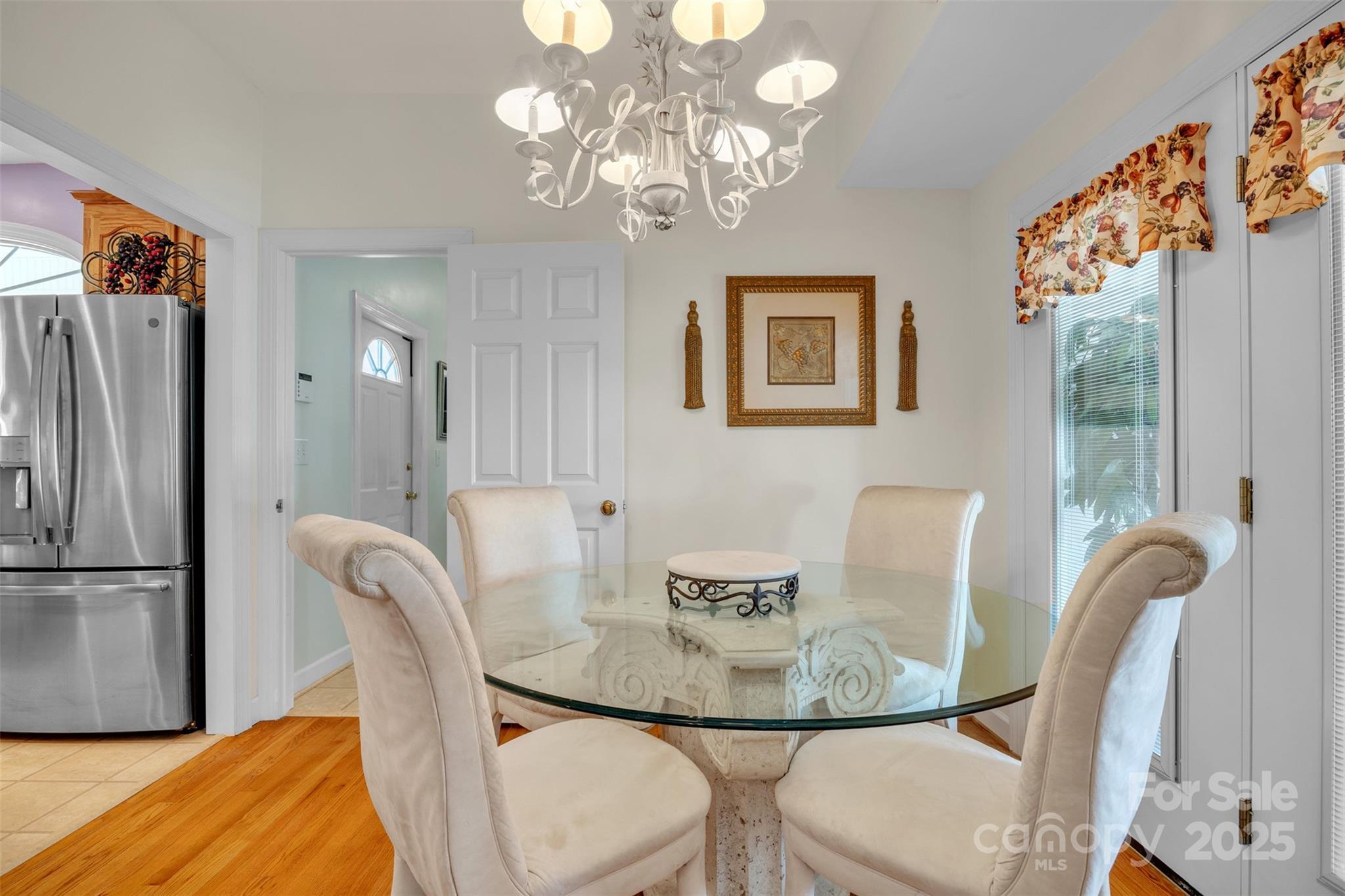129 Renaissance Place Statesville, NC 28625 - Photo 11 of 43 a view of a dining room with furniture and a chandelier