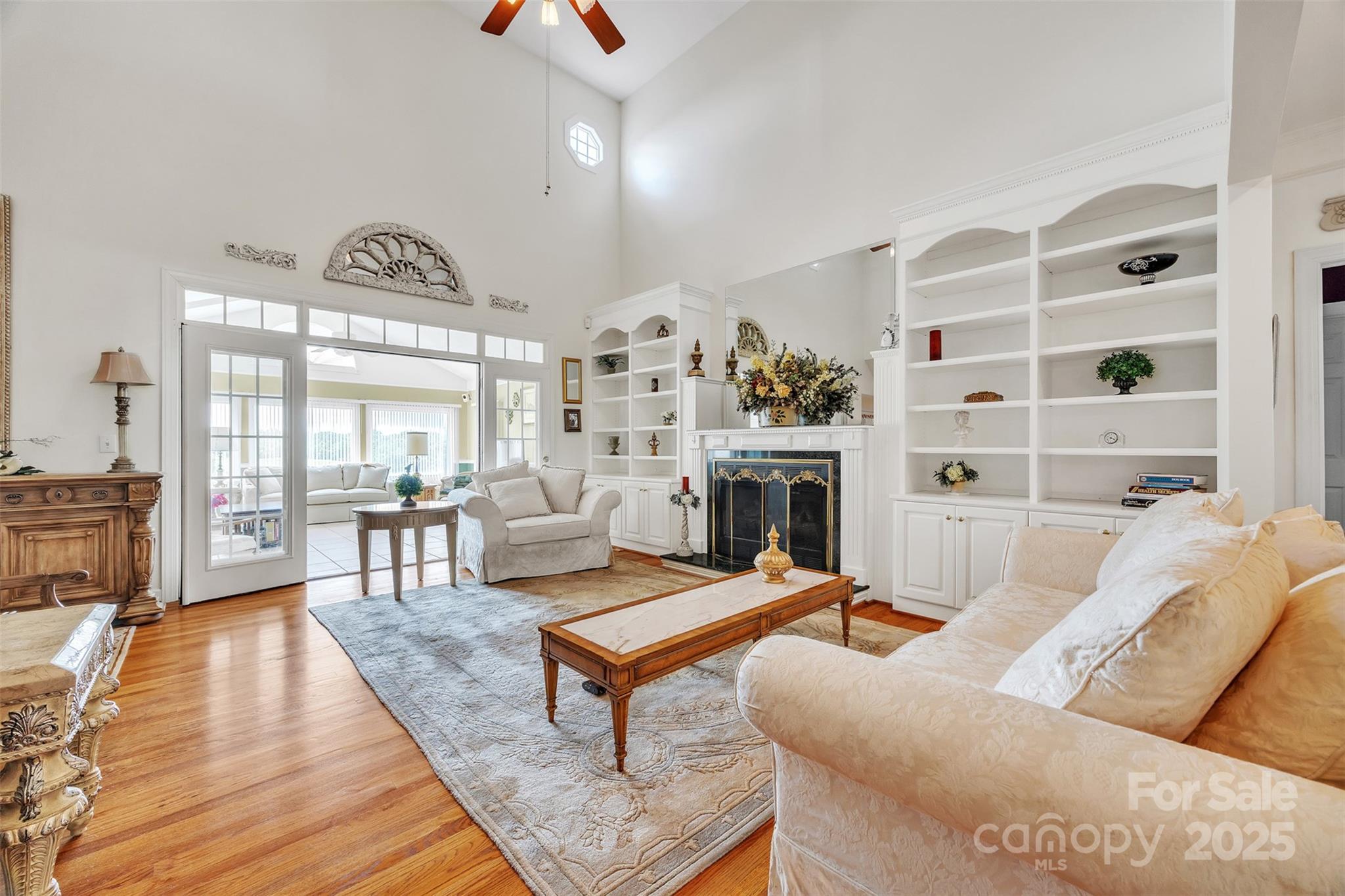129 Renaissance Place Statesville, NC 28625 - Photo 12 of 43 a living room with furniture a rug and a fireplace