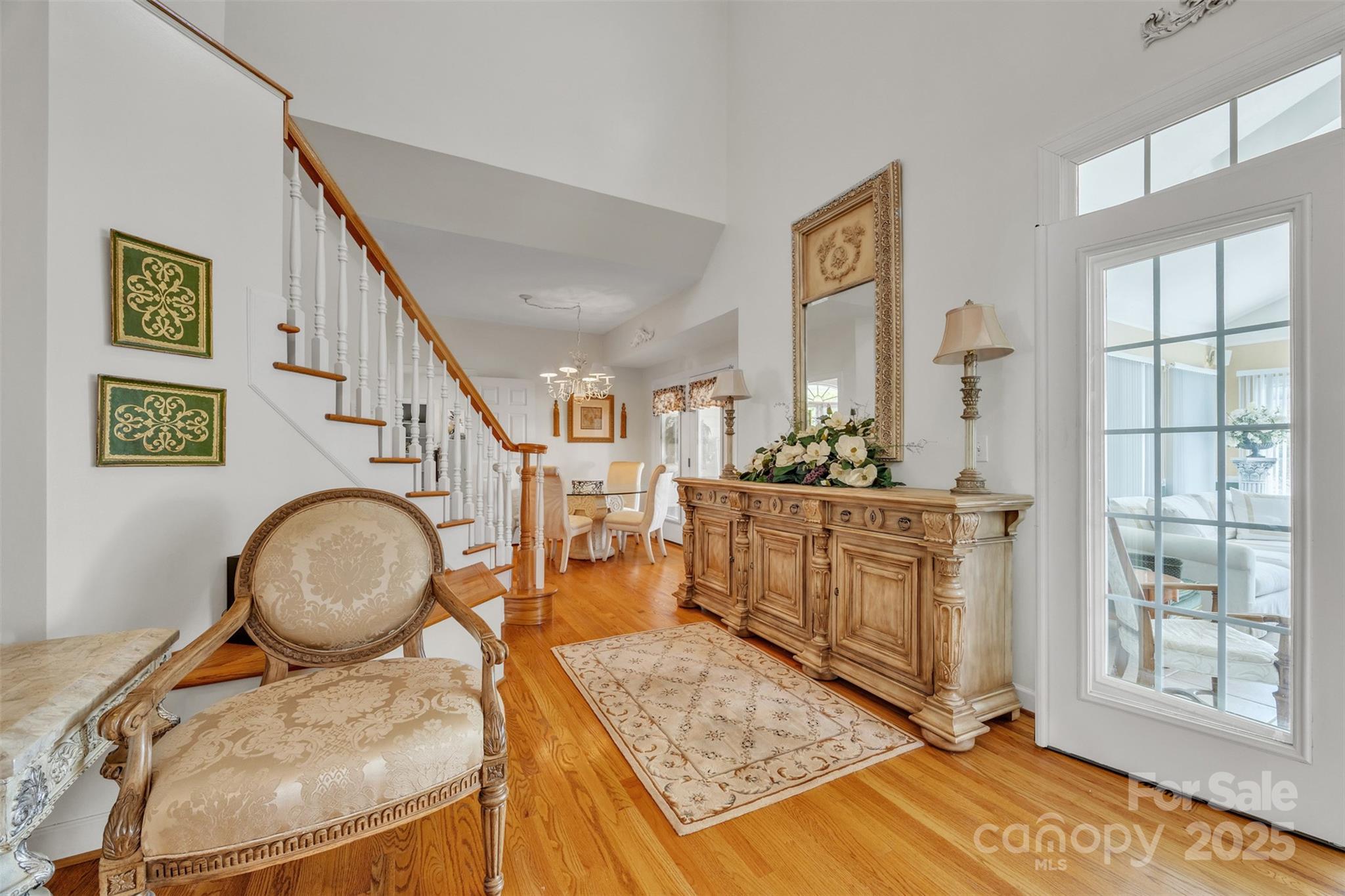 129 Renaissance Place Statesville, NC 28625 - Photo 13 of 43 a living room with furniture a wooden floor and a fireplace