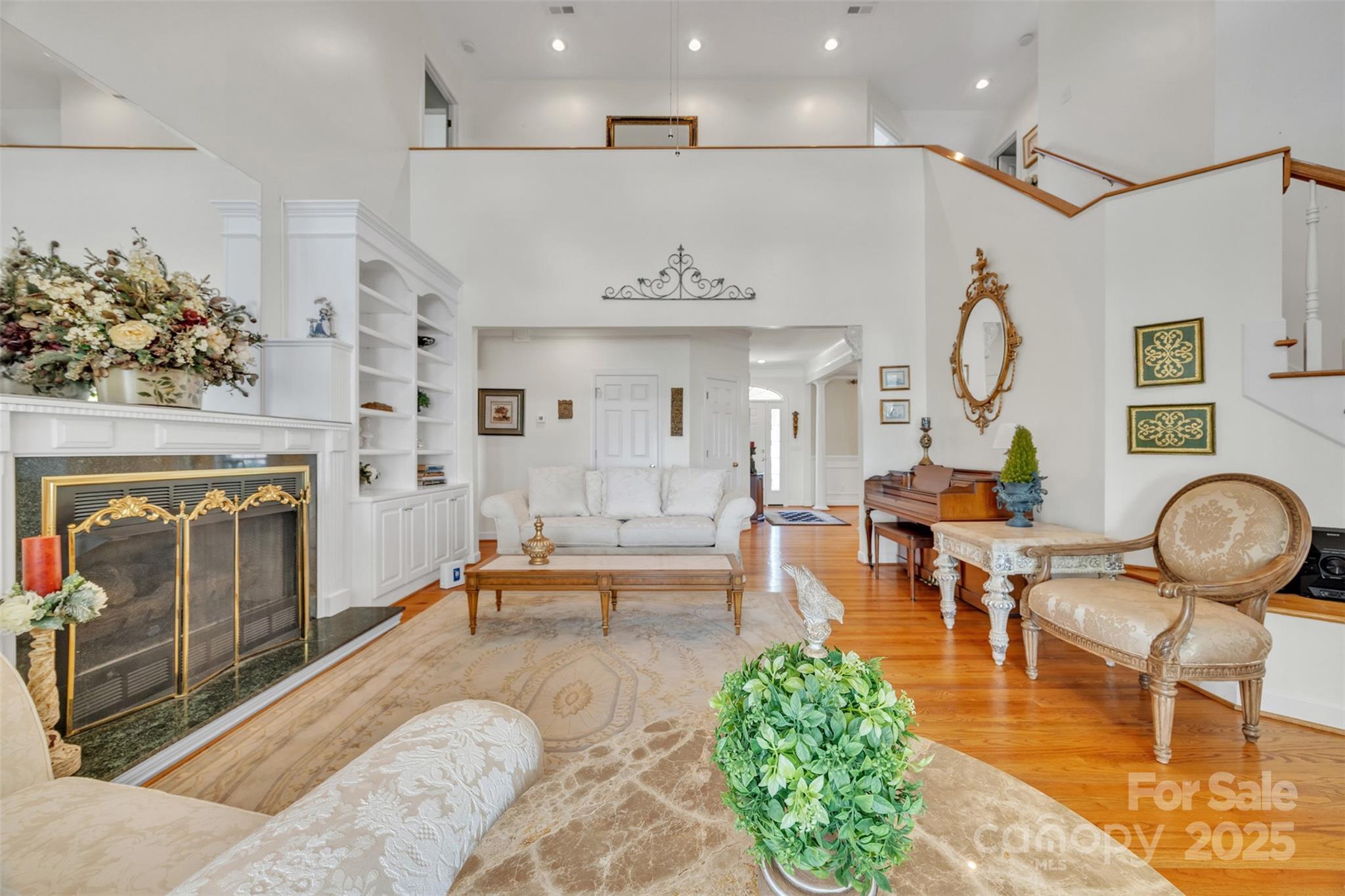 129 Renaissance Place Statesville, NC 28625 - Photo 14 of 43 a living room with fireplace furniture and a chandelier