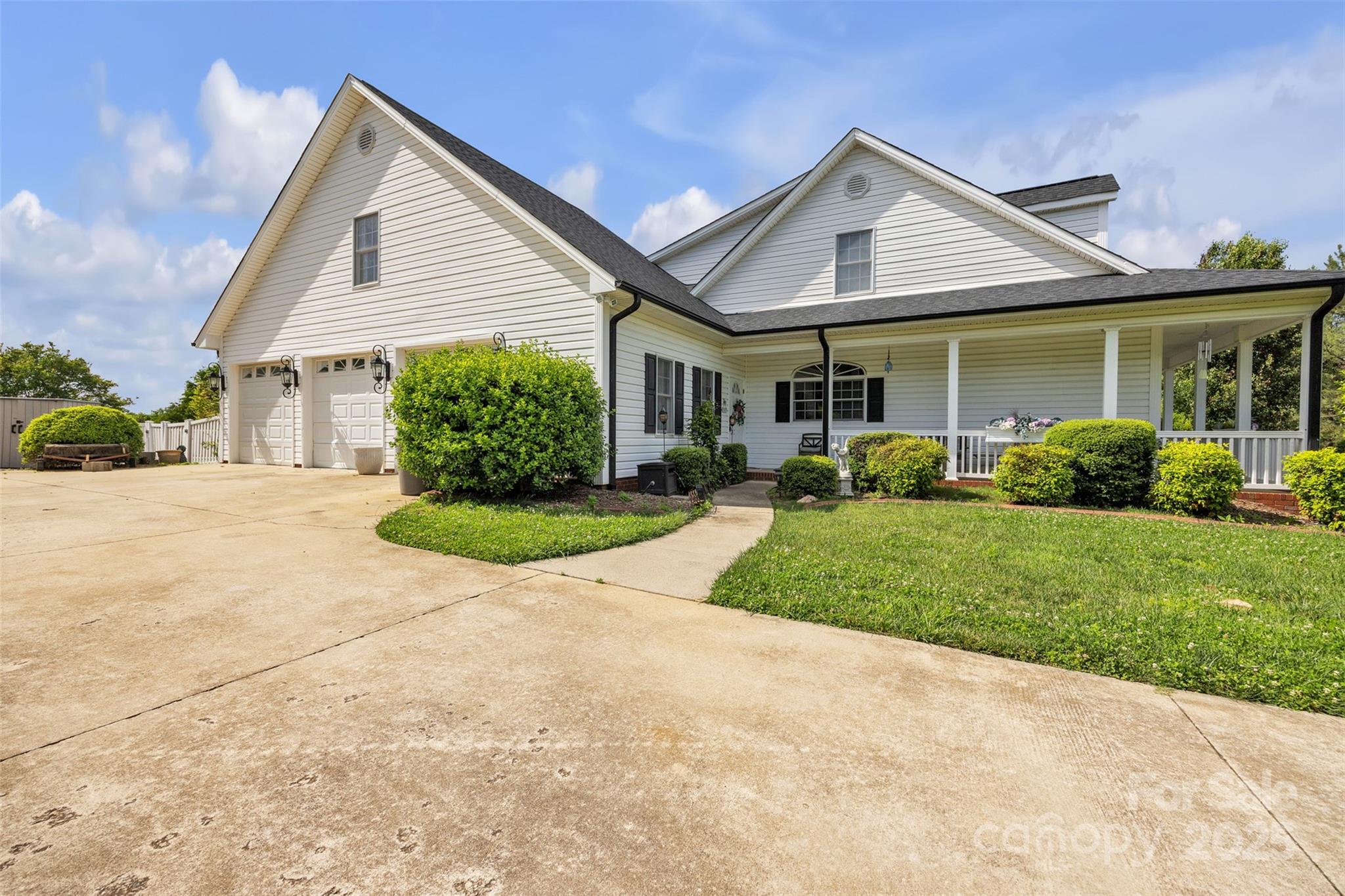 129 Renaissance Place Statesville, NC 28625 - Photo 2 of 43 a view of a house with next to a garden