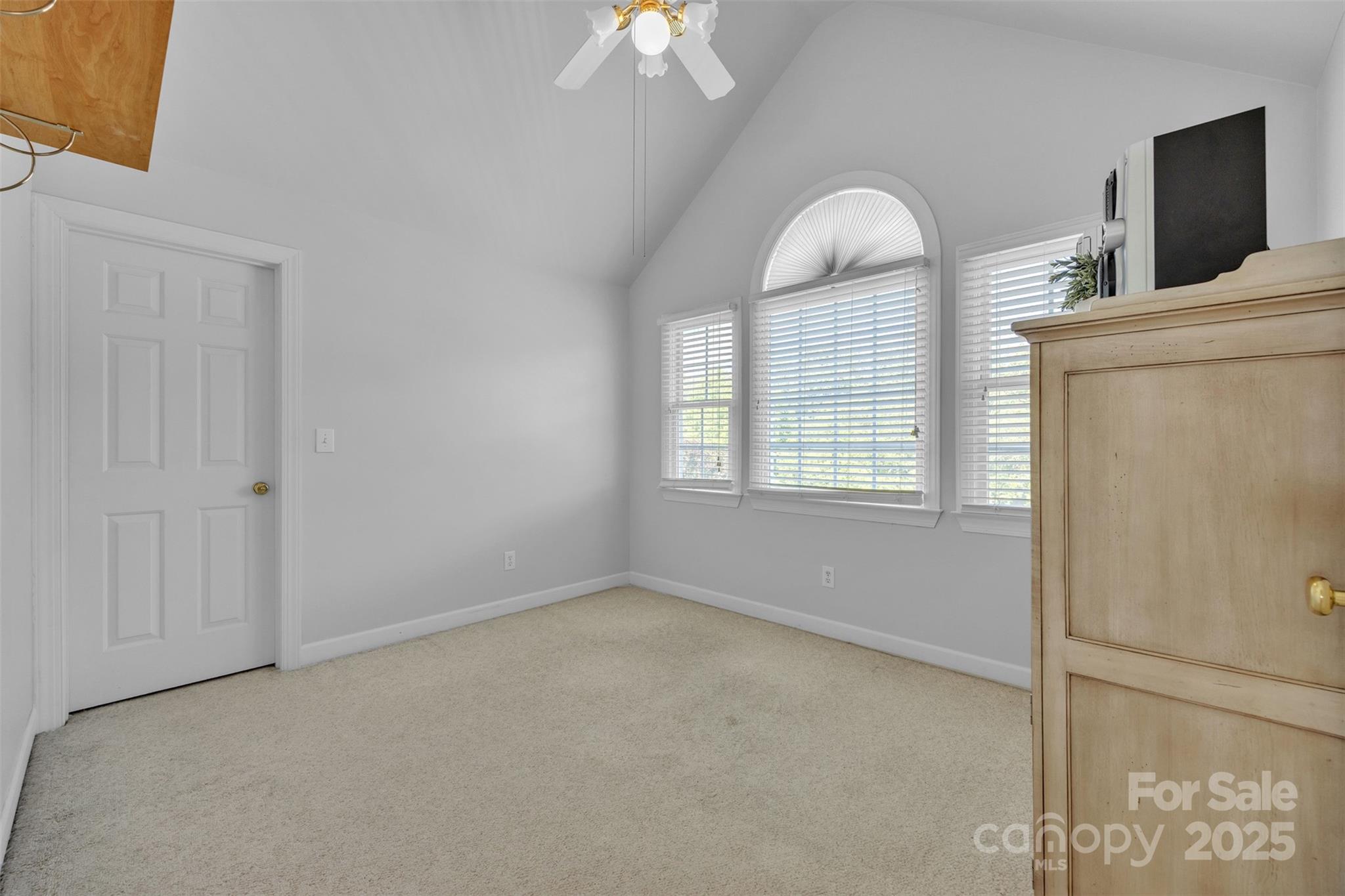 129 Renaissance Place Statesville, NC 28625 - Photo 25 of 43 a view of an empty room with window and chandelier fan