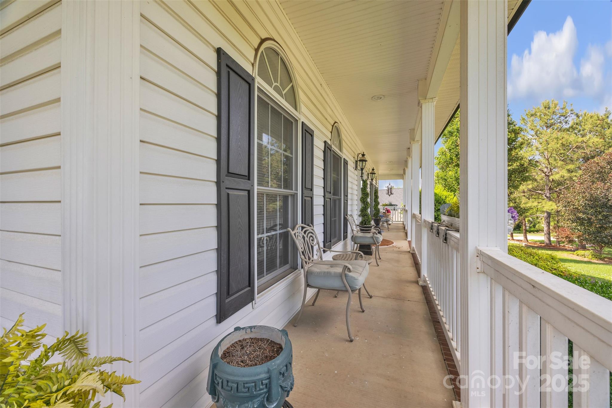 129 Renaissance Place Statesville, NC 28625 - Photo 42 of 43 a balcony with chairs and with potted plants