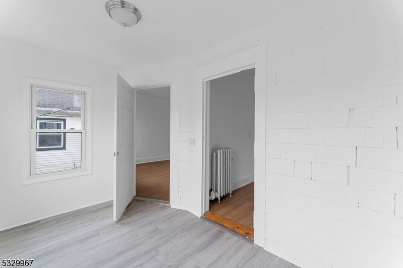 18 Lowden Street Elizabeth, NJ 07208 - Photo 8 of 17 a view of an empty room with closet and a window