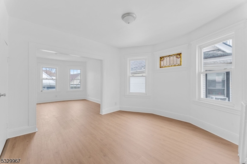 18 Lowden Street Elizabeth, NJ 07208 - Photo 9 of 17 a view of an empty room with a window