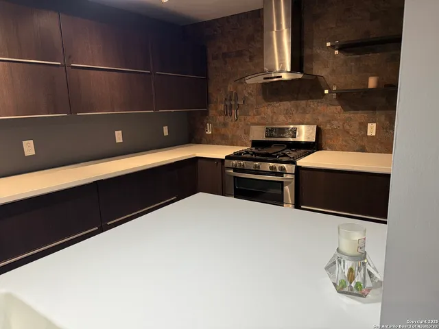 a kitchen with a cabinets and a stove