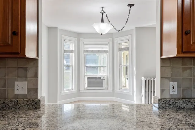 a view of a hallway with a chandelier