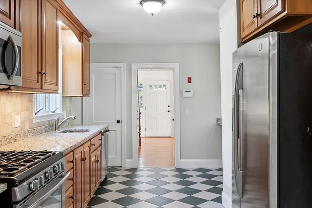 a bathroom with a sink a mirror and a shower