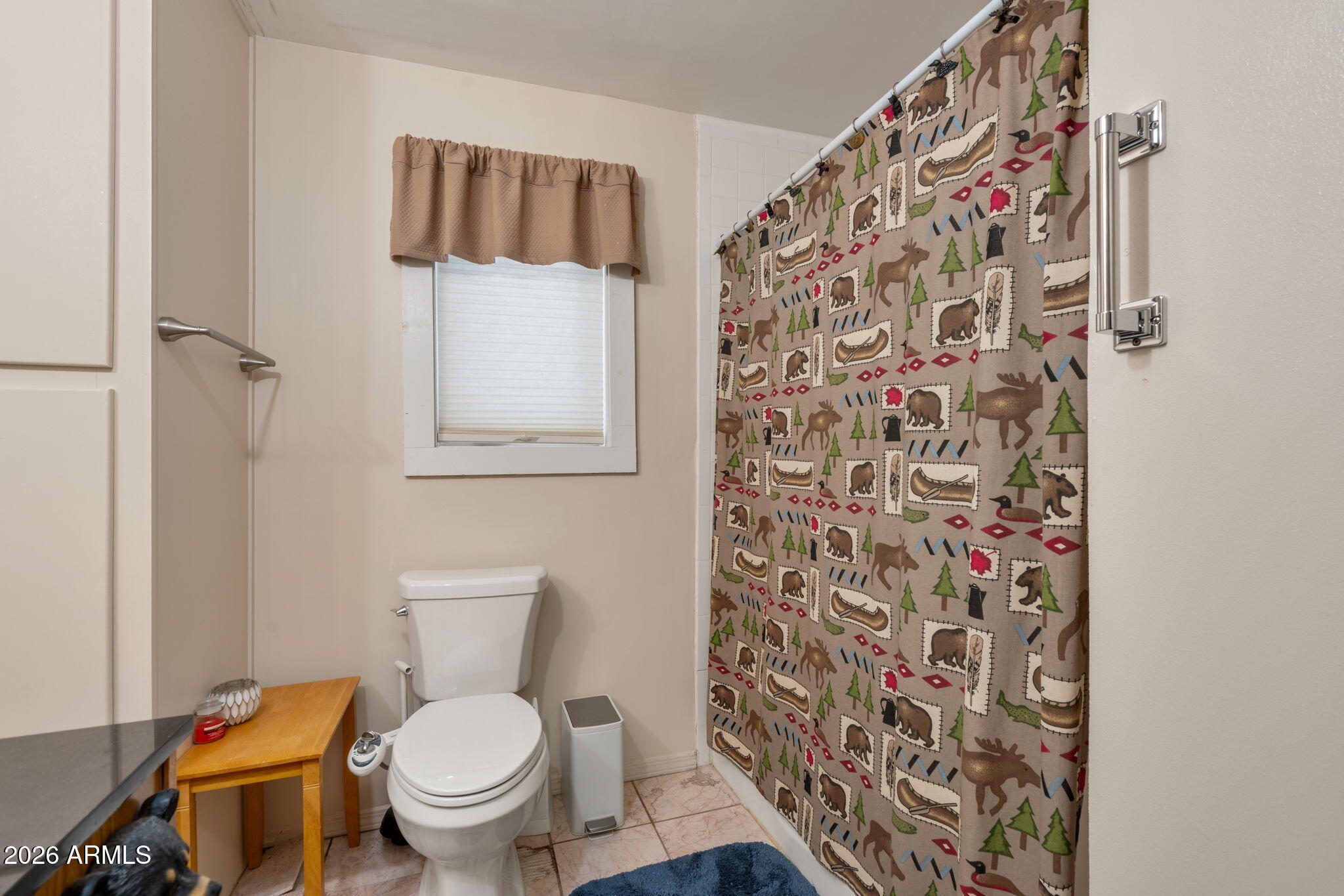 2095 Ranger Road Overgaard, AZ 85933 - Photo 9 of 25 a white toilet sitting next to a shower curtain