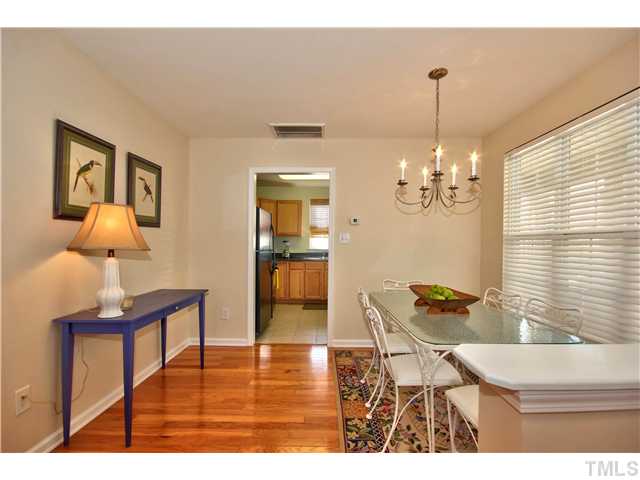 9827 Layla Avenue Raleigh, NC 27617 - Photo 11 of 20 a living room with furniture and a chandelier